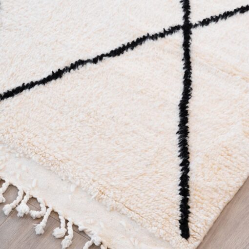 Tapis poils longs blan et noir