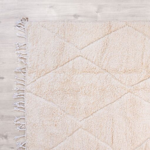 Tapis salon sur-mesure fibule berbère sable